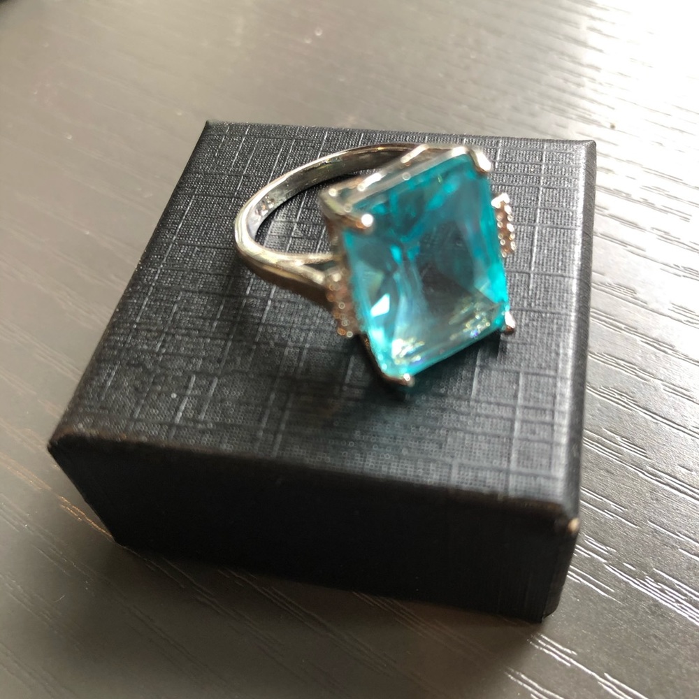 Blue stone, silver metal ring